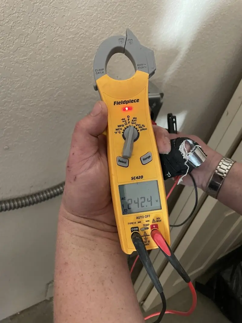 Voltage testing with clamp meter during Whole House Surge Protector in Farrell
